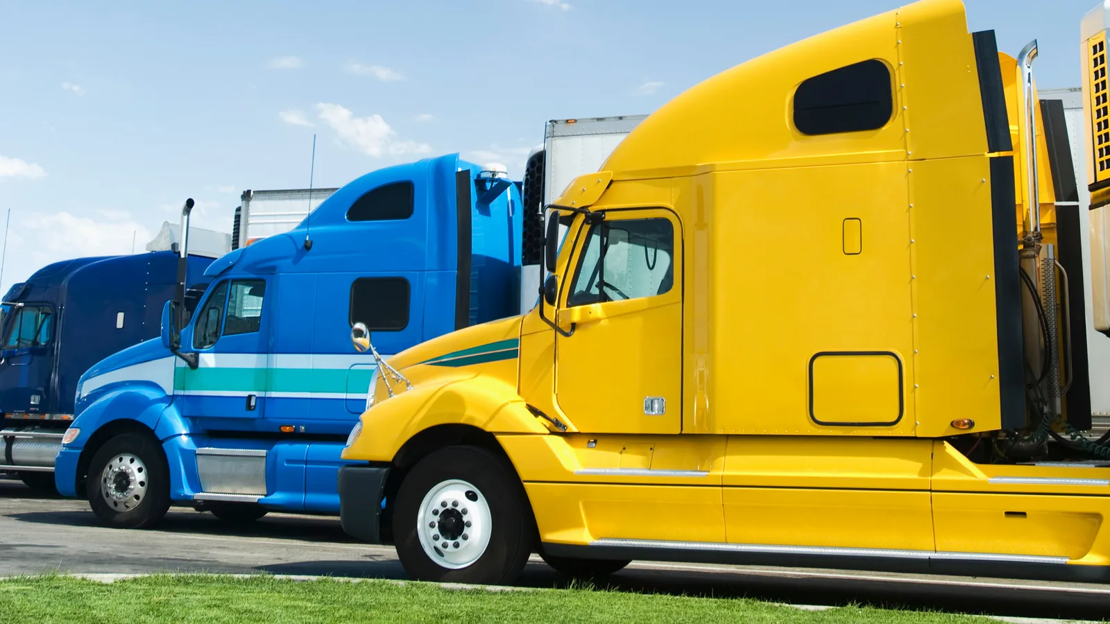 Semi trucks parked in a row